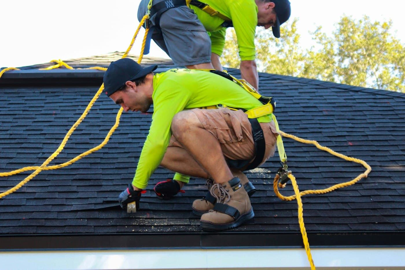 The Ironclad crew working on a roof