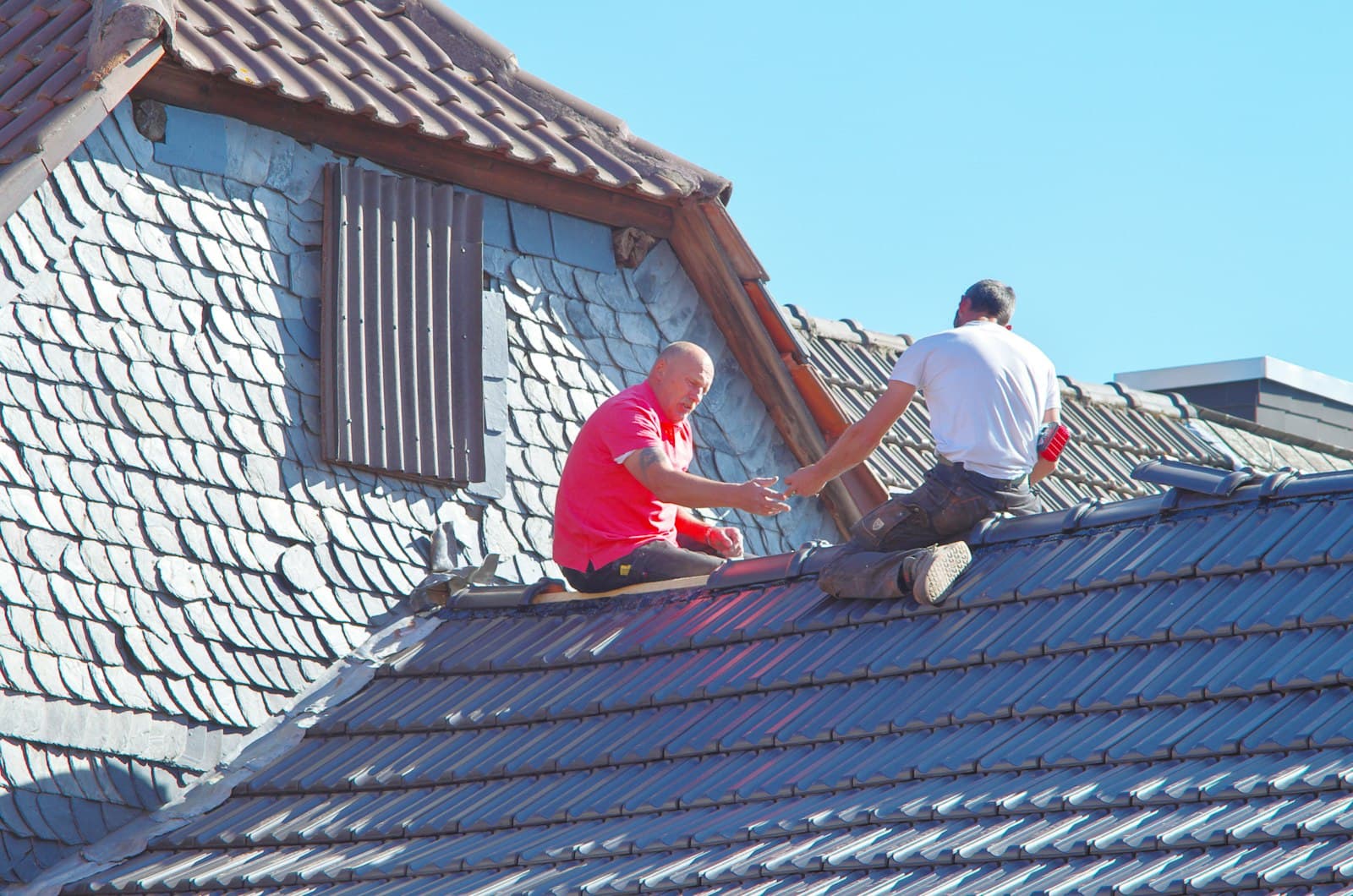 Roofers working on a residential roof